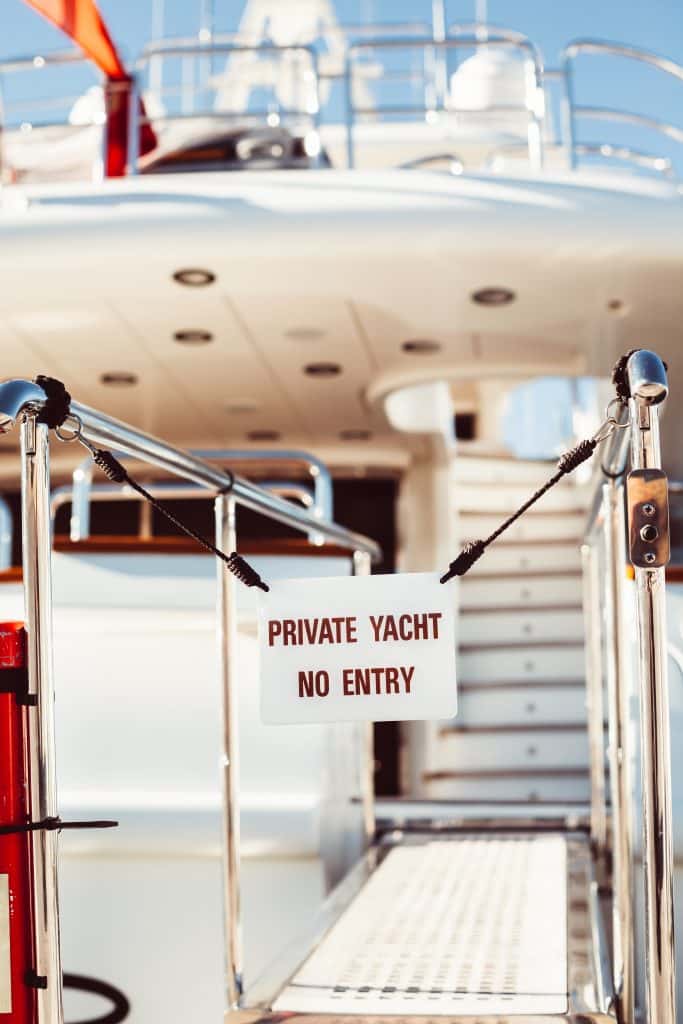Private yacht no entry sign on a boarding gate, an example of physical deterrence